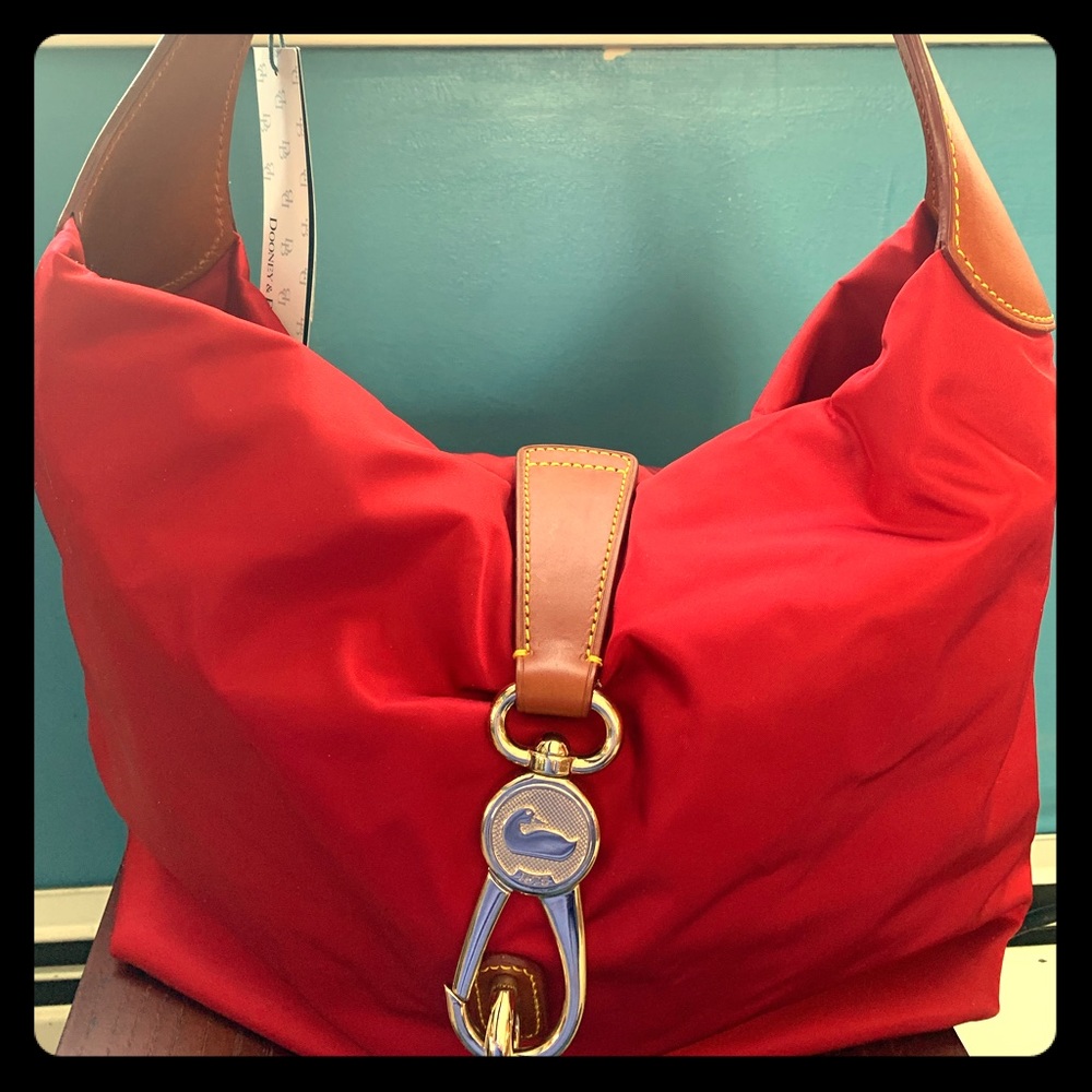 Dooney and Bourke NYLON red and tan leather strap